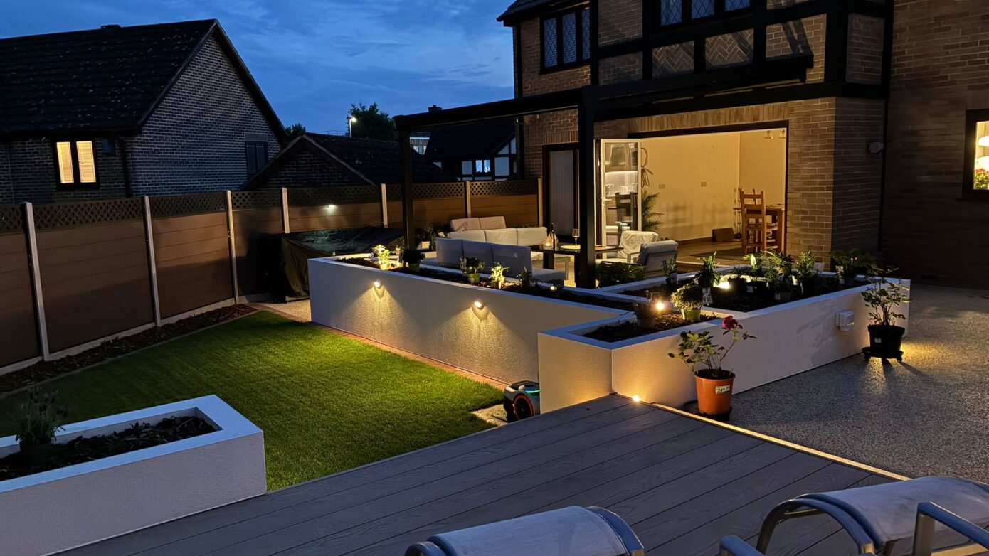 Garden lighting illuminating a landscaped Hampshire garden in the evening